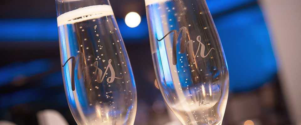 Close-up of Mr. and Mrs. champagne flutes.