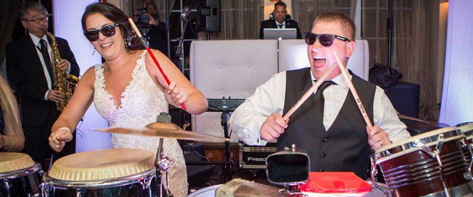 Bride and groom playing percussion at their wedding.