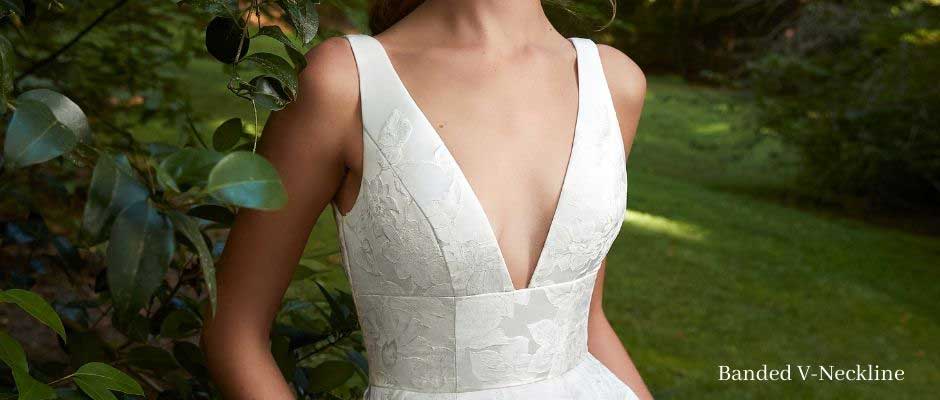 Anne Barge  plunging neckline with the textured fabric on a silk duchess, floral jacquard A-line gow