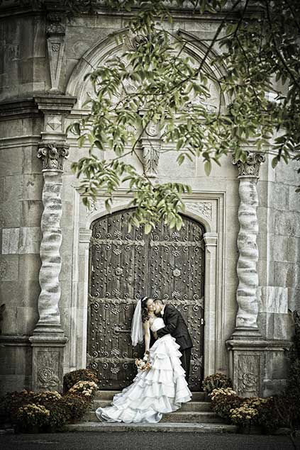 Bride and Groom in front of door at Planting Fields Arboretum