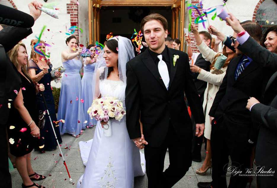 Bride and Groom walking out of church after being married