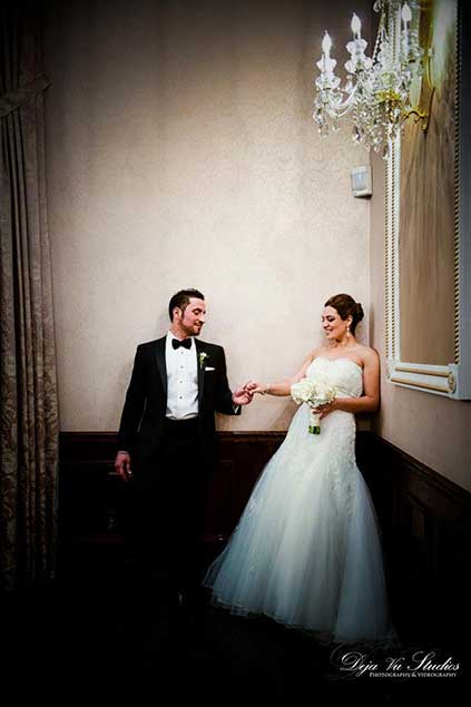 Casual photo of Bride and Groom in hallway 