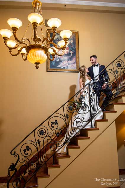 Couple standing  on the staircase looking  into each others eyes. 