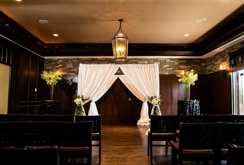 Indoor ceremony setup with chairs at Blackstone restaurant.