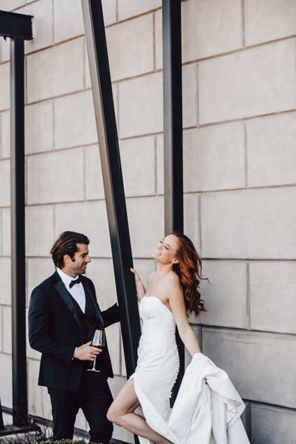 Groom looking  at his smiling bride face. 